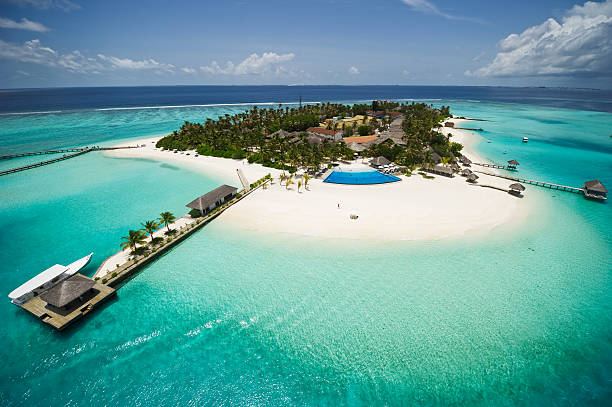 Exotic Island of Maldives Beautiful tropical island of Maldives shot from the air. A comfortable Maldives home stock pictures, royalty-free photos & images