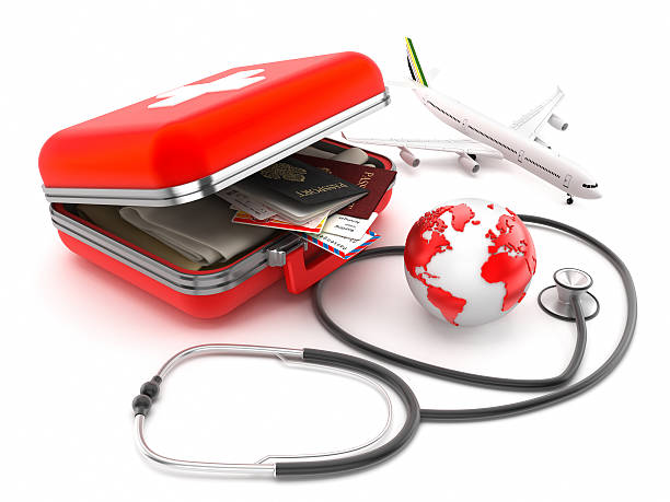 Medical tourism "First-aid kit designed as a suitcase with passports, plane tickets and clothes inside, stethoscope and globe isolated on white. Medical tourism concept.Map link (Derived from): http://www.lib.utexas.edu/maps/world_maps/txu-oclc-264266980-world_pol_2008-2.jpgSimilar:" First aid essentials for travel stock pictures, royalty-free photos & images
