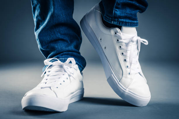 Men wearing sneakers Men wearing sneakers Shoes are the only essential stock pictures, royalty-free photos & images