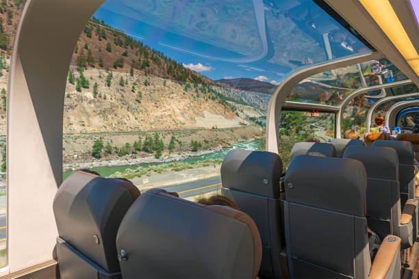 Rocky Mountaineer Train Carriage, Canada Passengers sitting inside the 360 degrees panoramic train carriage with Fraser River view, Rocky Mountaineer train, Canada. Luxury train journeys stock pictures, royalty-free photos & images