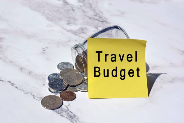 Text on yellow notepad stick on a jar with Chinese yuan coin on the white table surface - Travel budget Text on yellow notepad stick on a jar with Chinese yuan coin on the white table surface - Travel budget Best Budget Travel Tips for First-Time Backpackers stock pictures, royalty-free photos & images