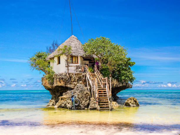 Zanzibar May 2016, The rock restaurant Zanzibar ,Over water house build in a coral rock in Zanzibar Zanzibar May 2016, The rock restaurant Zanzibar ,Over water house build in a coral rock in Zanzibar tropical Island Zanzibar stock pictures, royalty-free photos & images